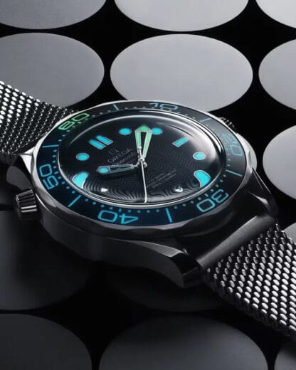 Close-up of Omega Seamaster Diver 300M blue anodized aluminum dial with laser-engraved waves
