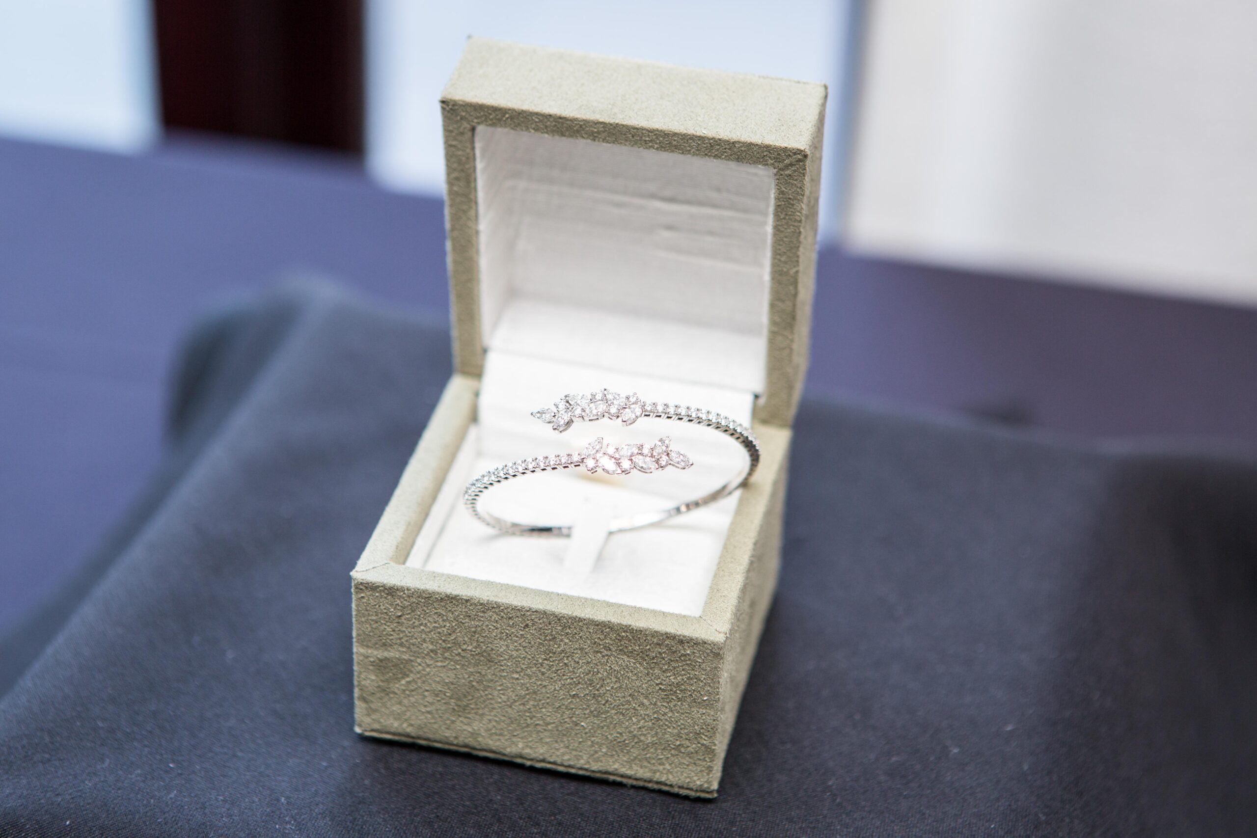 18k white gold diamond bracelet featuring a graceful bypassing floral design