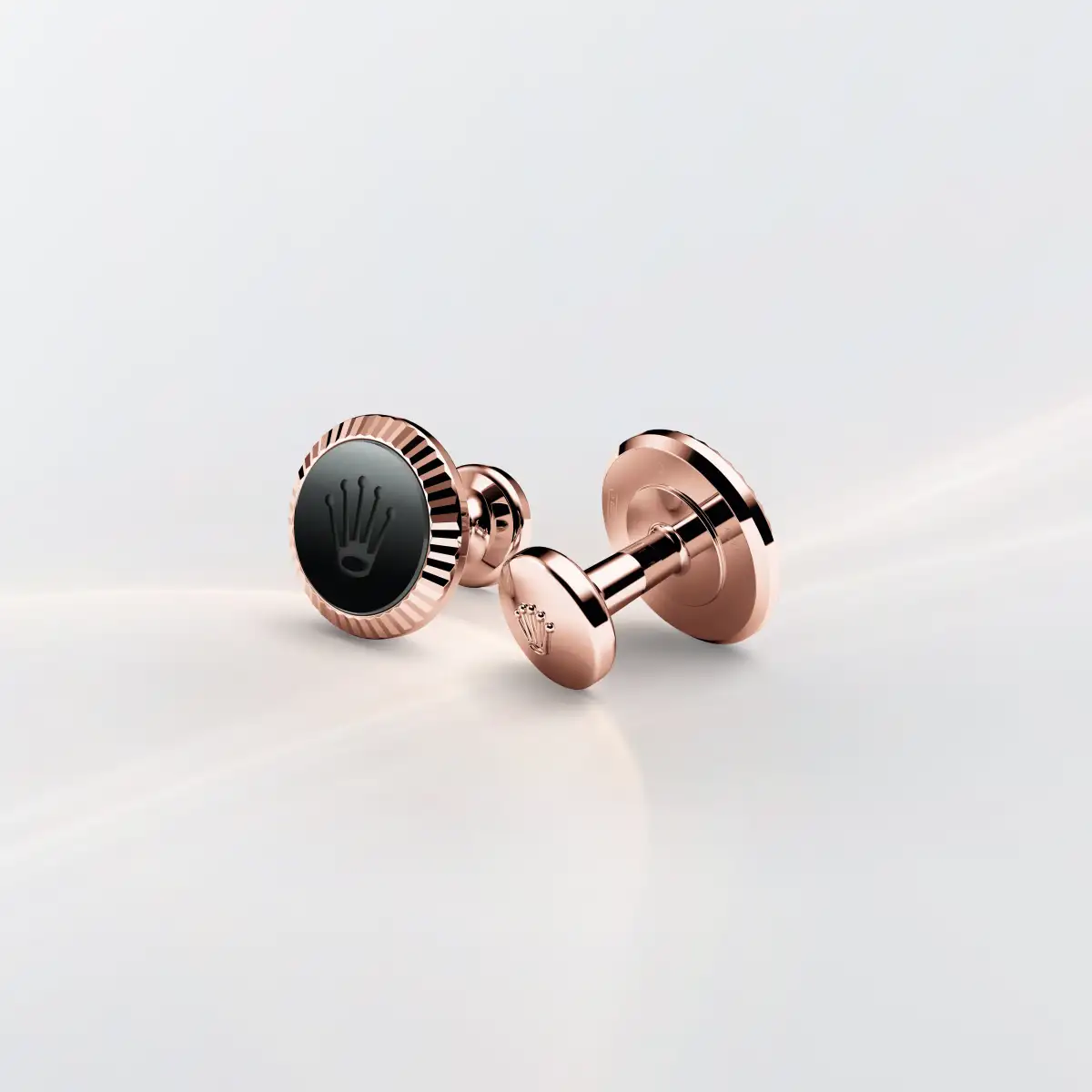 Rolex ‘Fluted’ cufflinks in Everose gold and ceramic 18 ct Everose gold Cerachrom circle in black ceramic, a1035 at Montecristo Jewellers